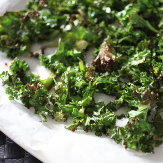 crispy kale chips on a baking sheet