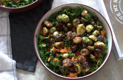 bowl of winter vegetable salad in a large pasta bowl placed on a dining table