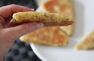 parsnip scone being held up to show thickness