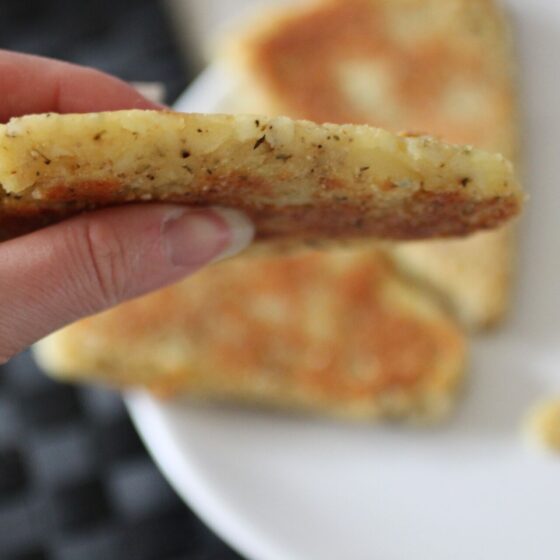 parsnip scone being held up to show thickness