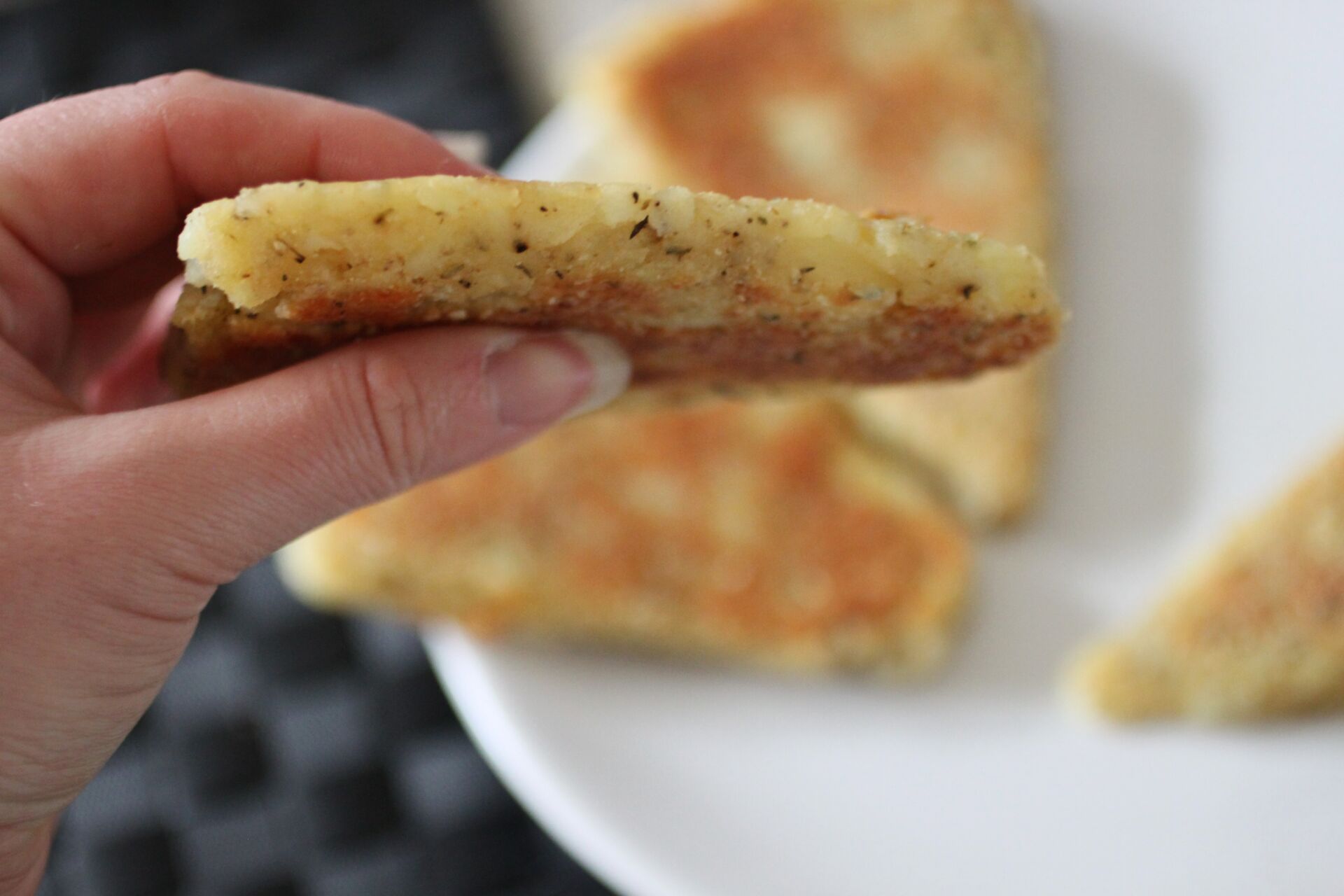 parsnip scone being held up to show thickness
