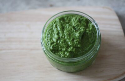 pot of lemon kale dressing on a wooden tray