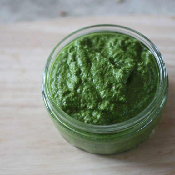 pot of lemon kale dressing on a wooden tray