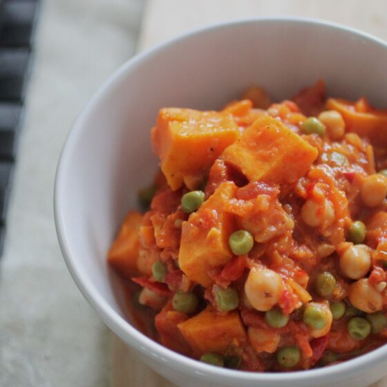 bowl of 5-a-day smokey vegetable casserole placed on a wooden board