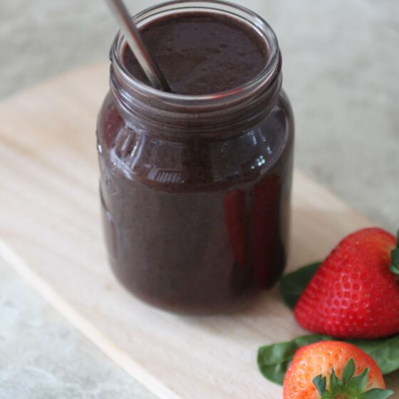 beetroot smoothie in a kilner jar on a wooden board