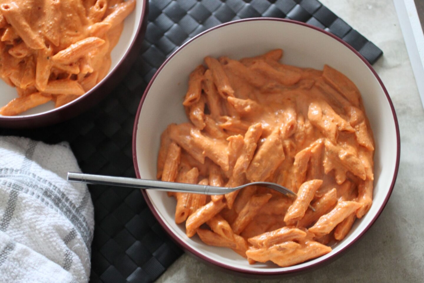 creamy tomato pasta recipe in a large pasta bowl, shot from above