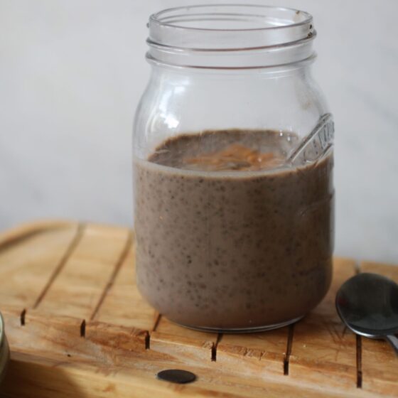 jar of peanut butter protein chia pudding placed on a tray