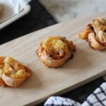three pizza twists on a wooden tray