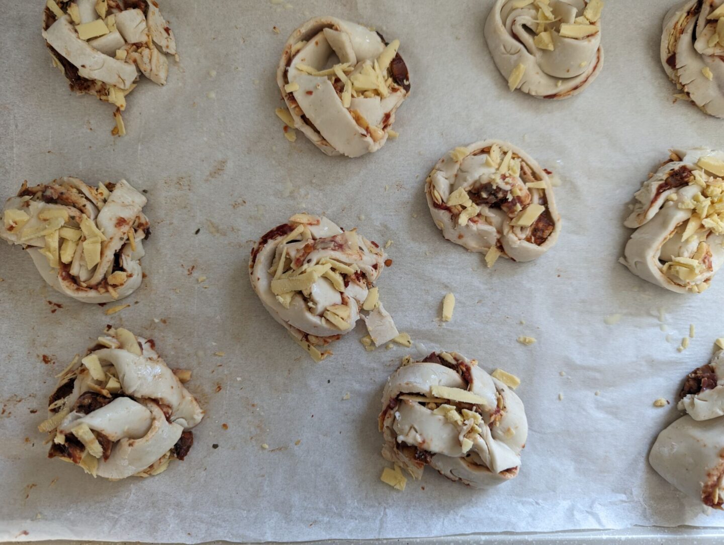 baking sheet with pizza twists prior to going into the oven