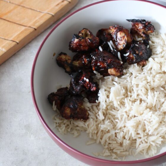sesame cauliflower with rice in a large pasta bowl