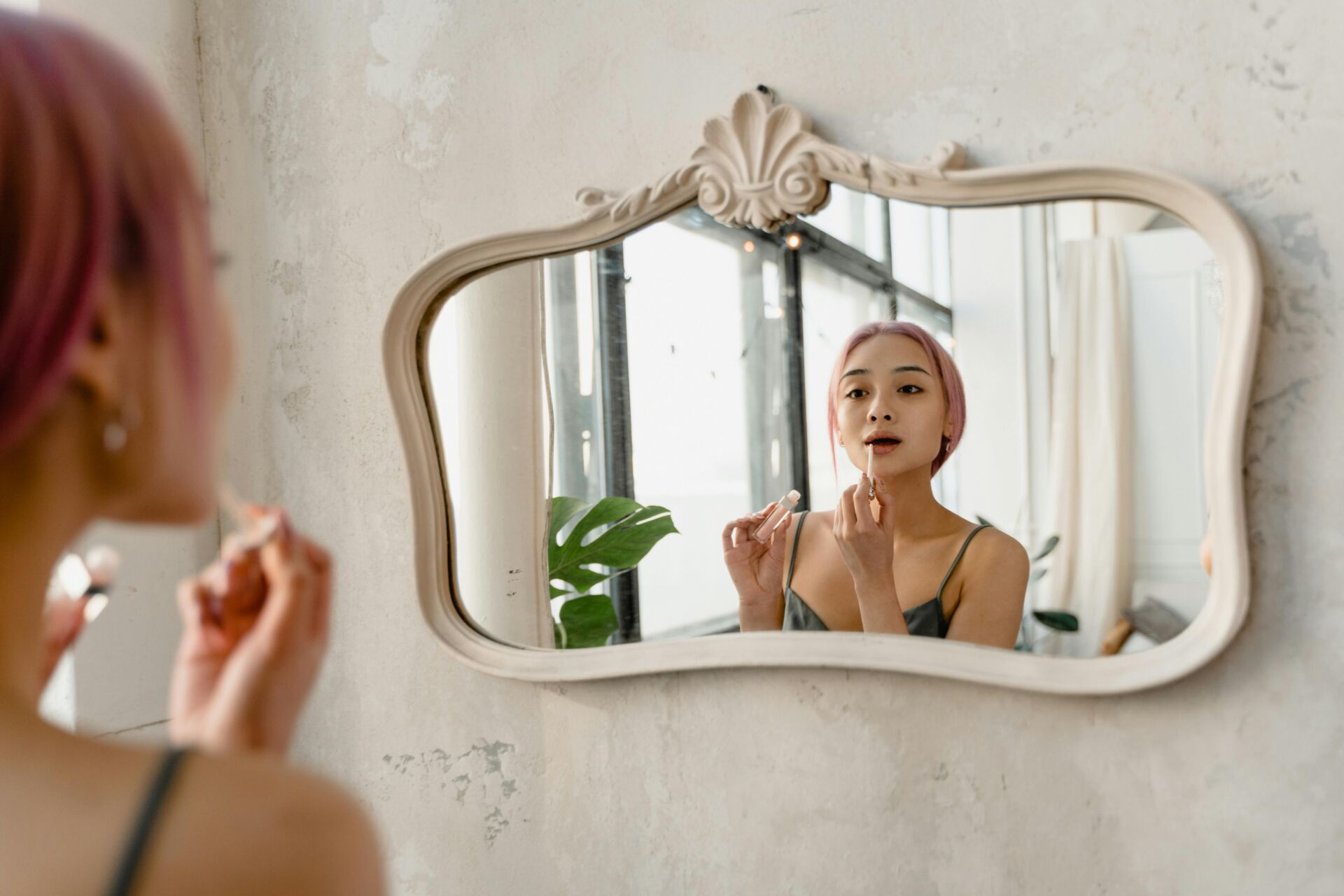 woman looking in the mirror