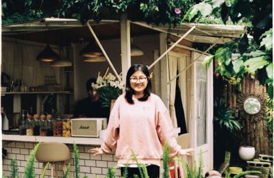 woman stood outside an outdoor bar