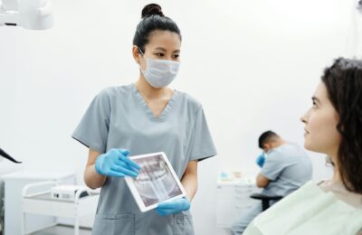 woman at the dentist being shown x-ray