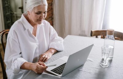 an older woman using a laptop