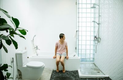 woman sat in a bathroom