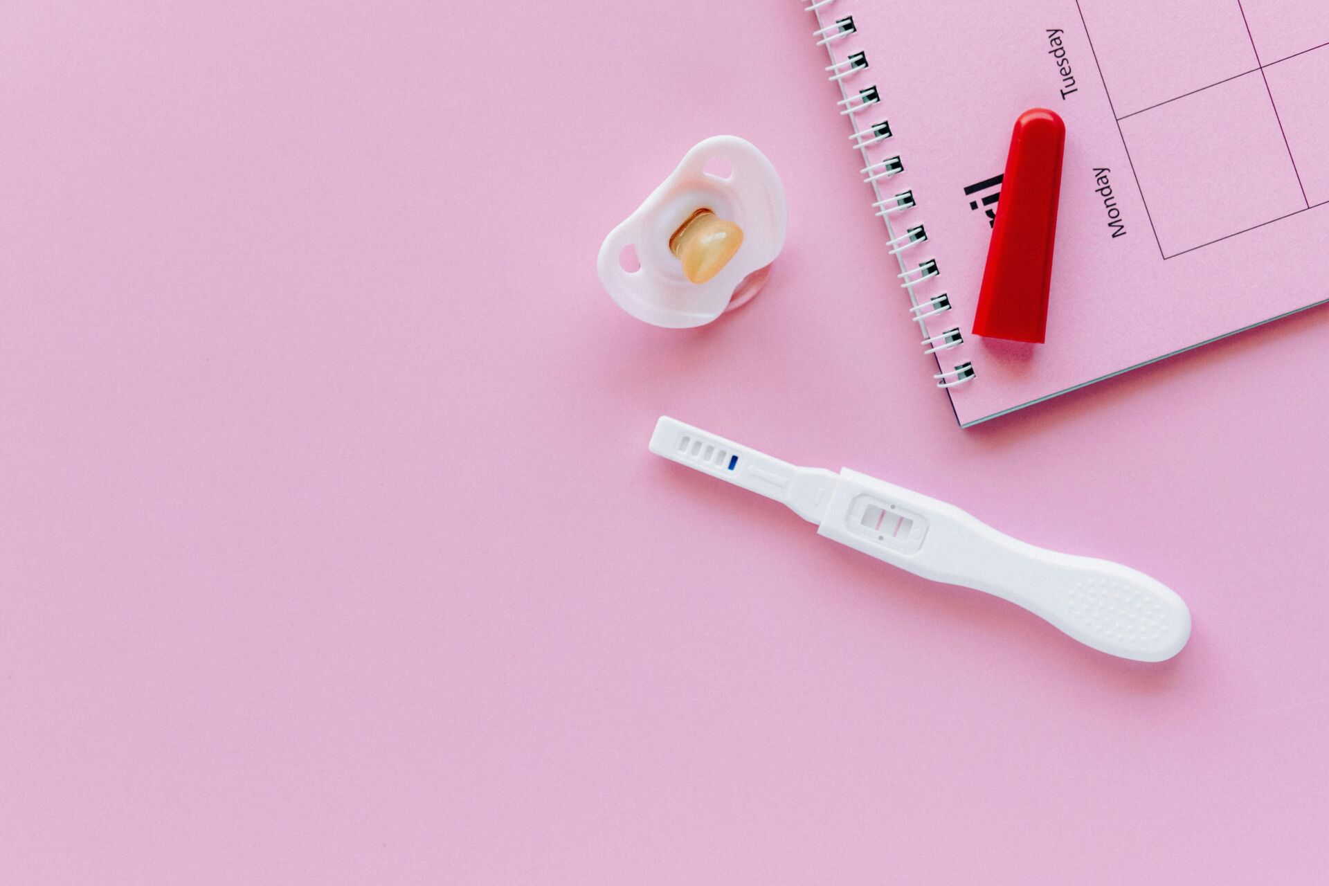 a calendar with a pregnancy test