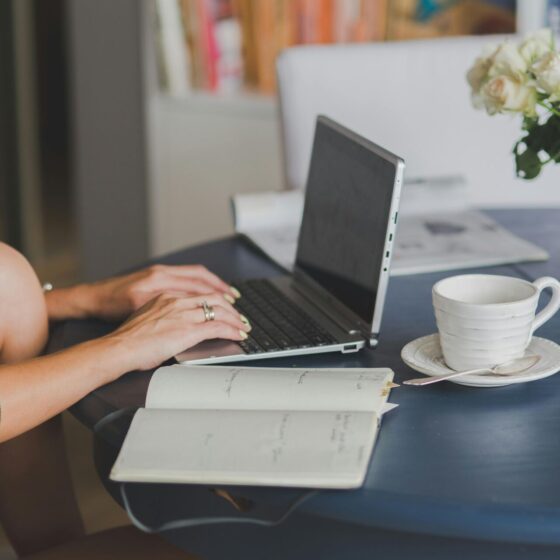 woman working on laptop at table