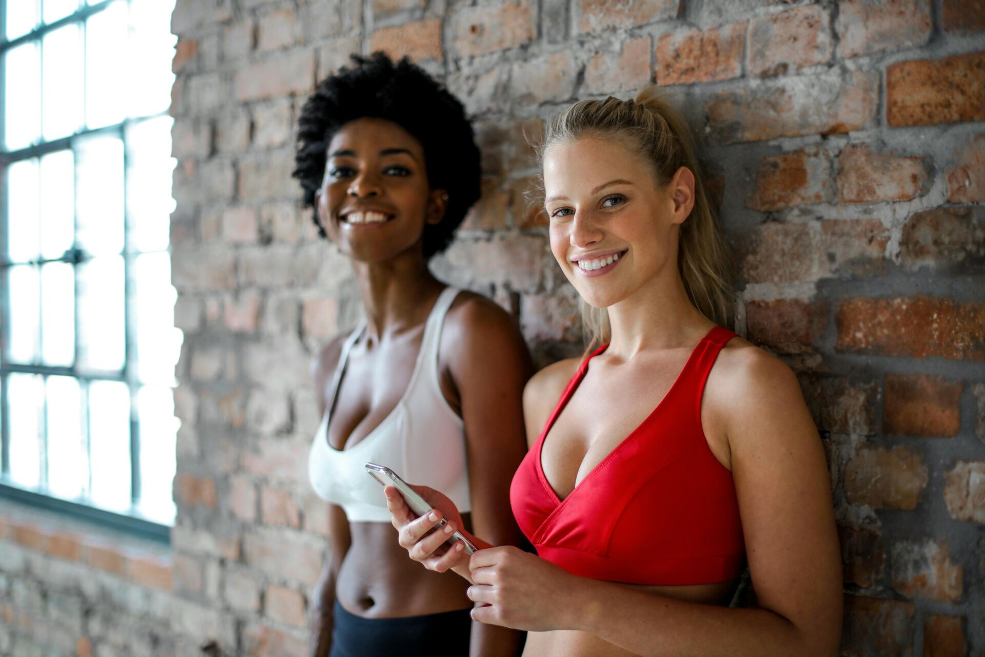 two women wearing sports bras
