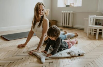 woman exercising on the floor with a child