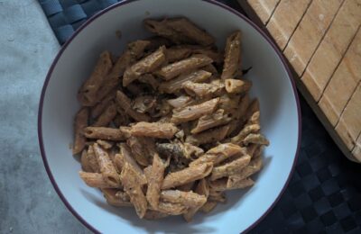large pasta bowl filled with creamy courgette wild mushroom pasta