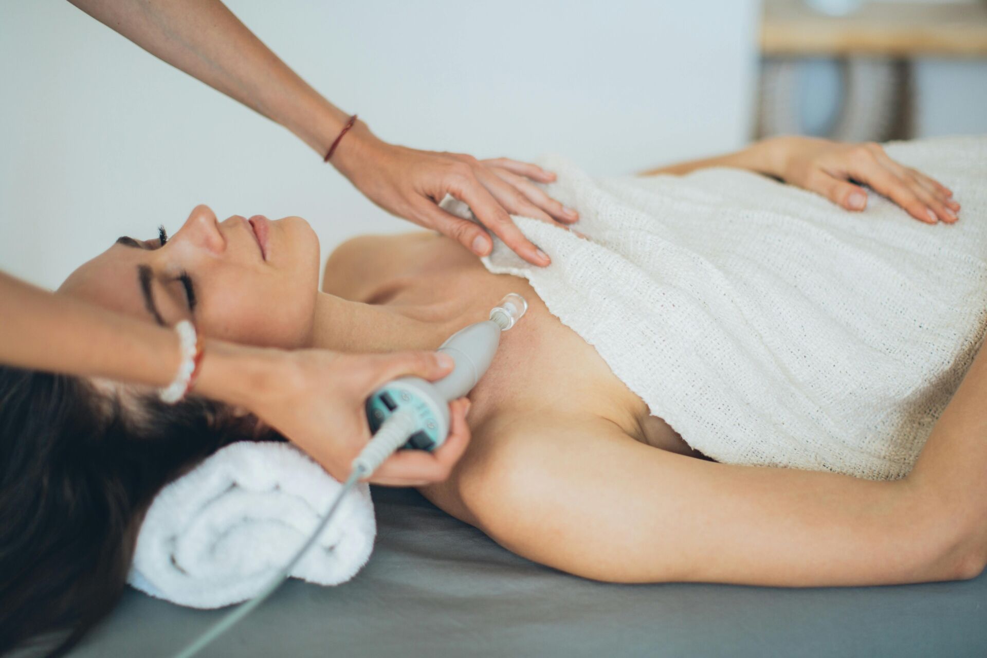 woman on cosmetic table getting treatment