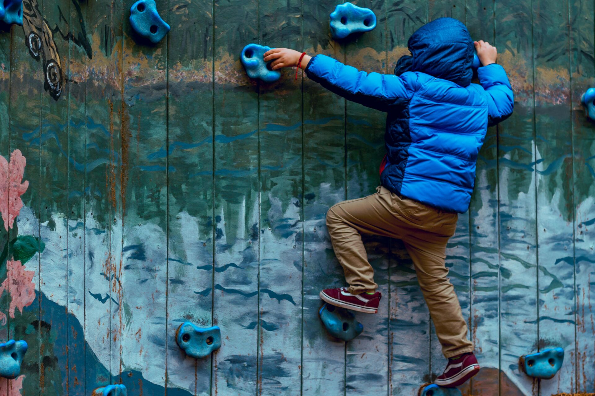 young boy on a climbing wall