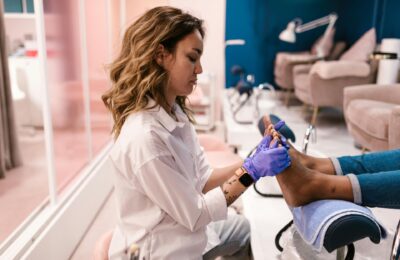 woman giving someone a pedicure