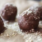 tray if pistachio butter bites covered in ground almonds