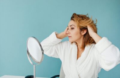 woman looking in mirror