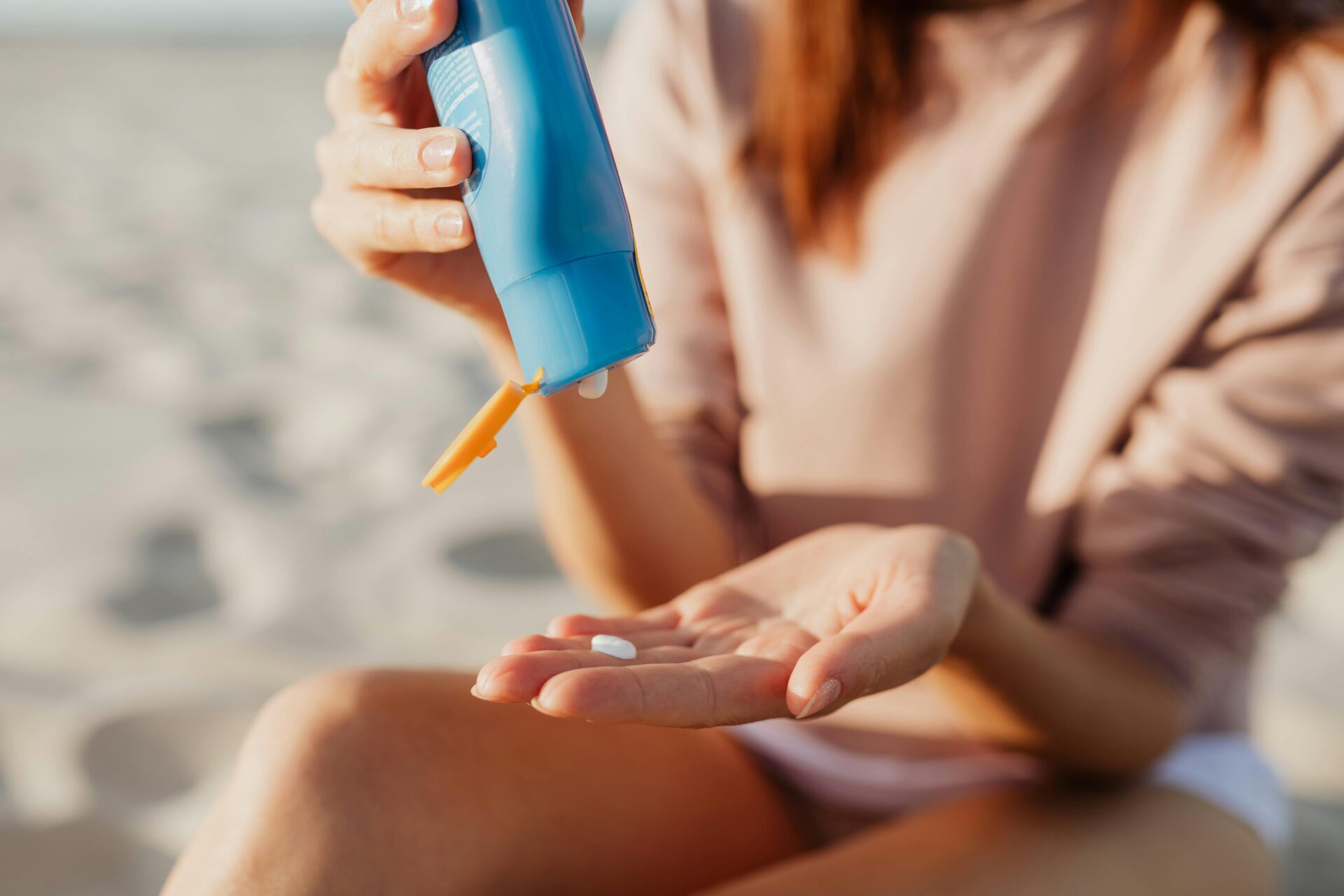 woman applying SPF