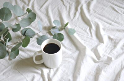 coffee cup on a white sheet