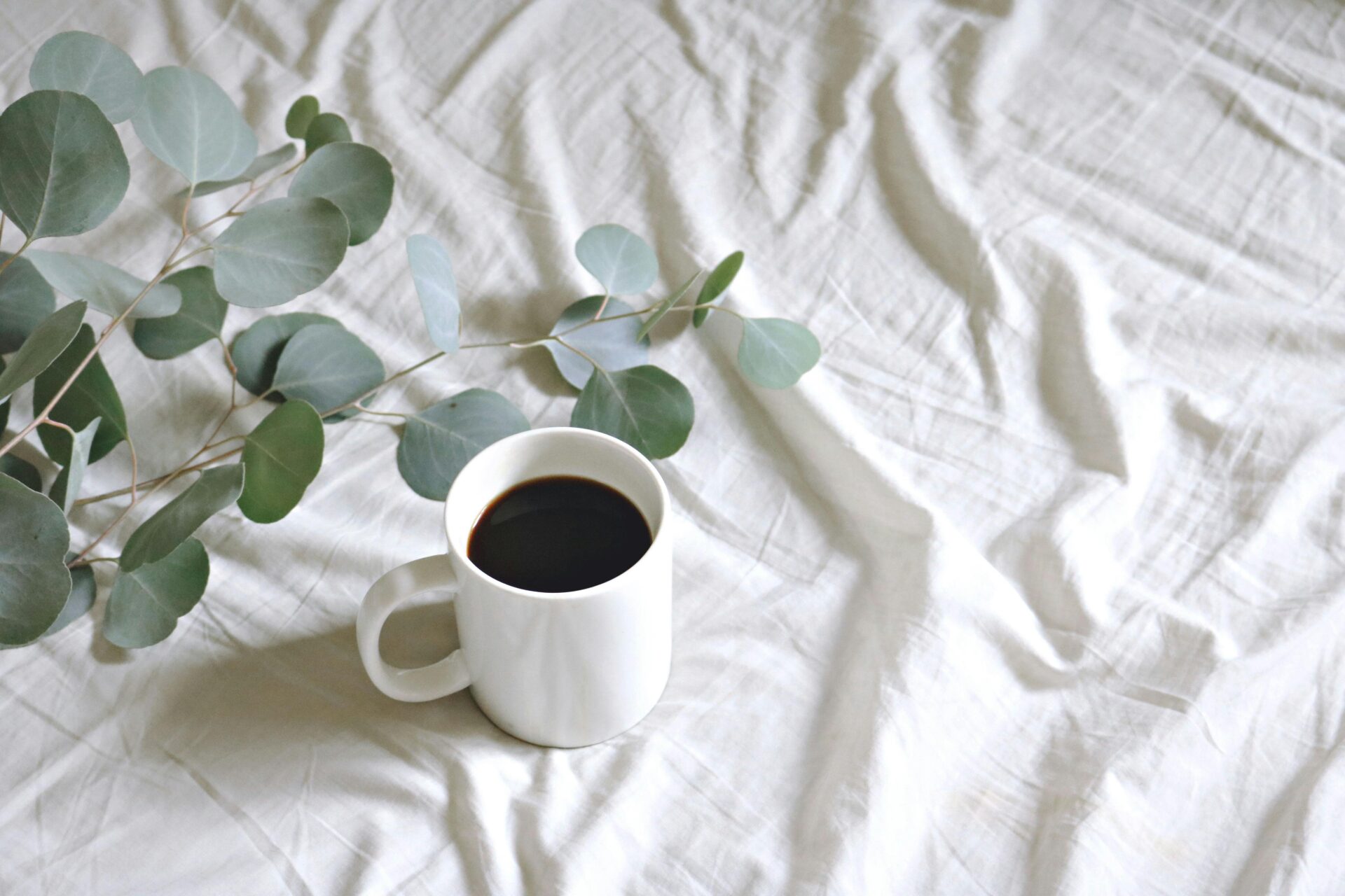 coffee cup on a white sheet