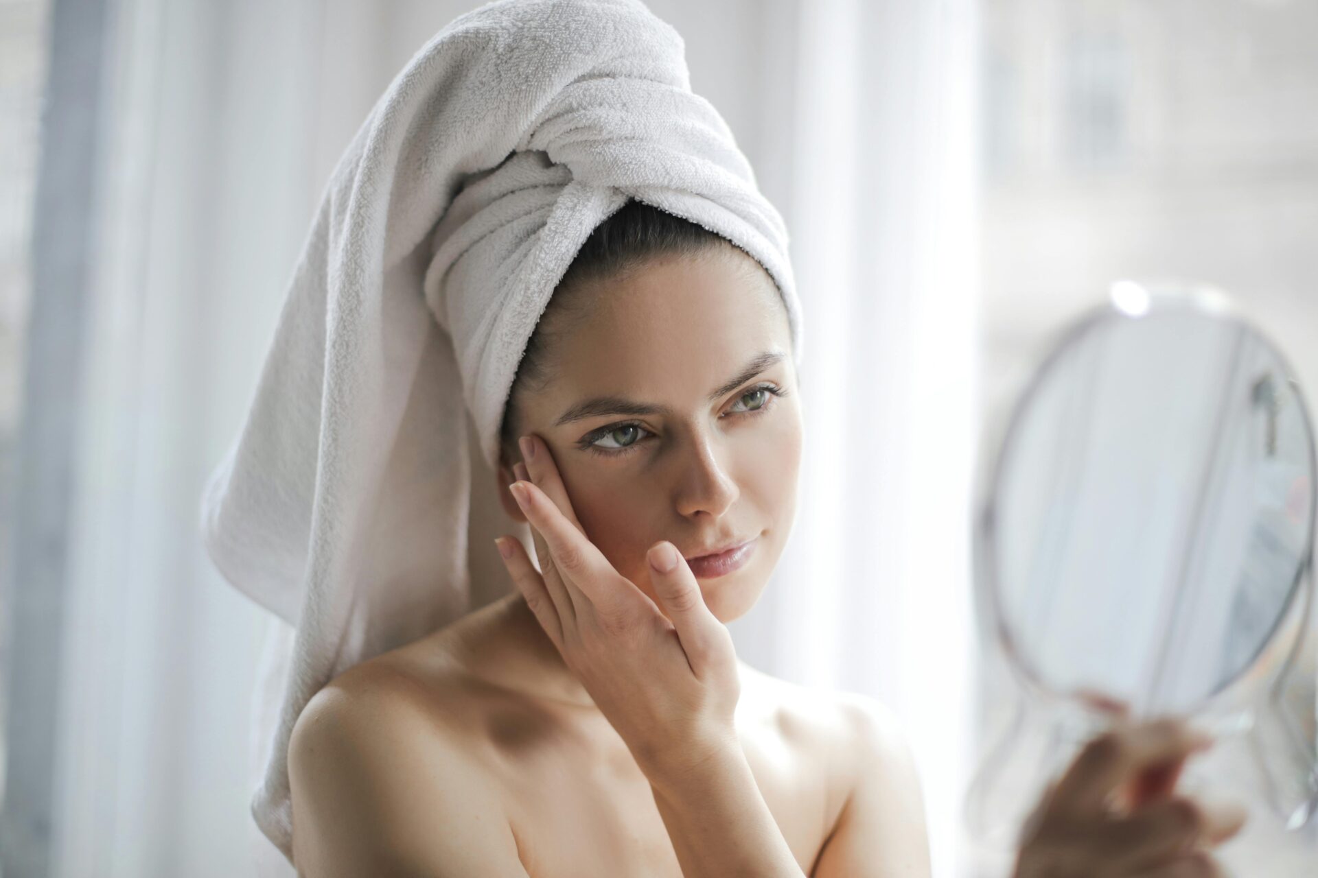 woman looking in mirror