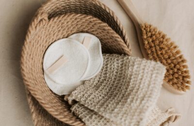 a neutral background with cotton pads and cloths