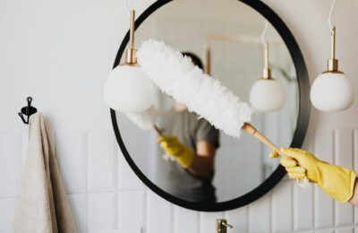 cleaning a bathroom mirror