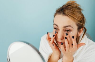 woman applying eye cream